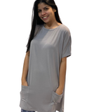 WOMAN WEARING GRAY T-SHIRT DRESS WITH POCKETS