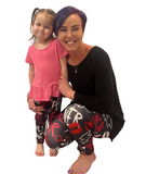 Mom and daughter wearing girl power leggings