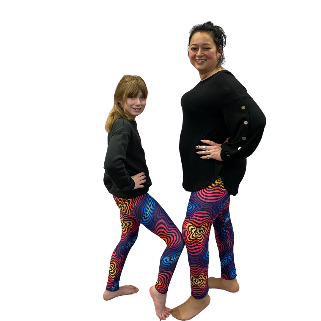 Mom and daughter wearing matching colorful leggings