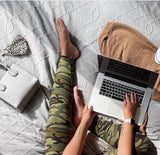 Woman wearing one size green camo yoga leggings