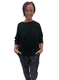 Woman wearing black hockey jogging pants