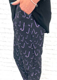 Woman wearing purple and black jogging pants