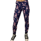 WOMAN WEARING FLORAL YOGA LEGGINGS