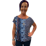 WOMAN WEARING SHORT SLEEVE BLUE PATTERNED SHIRT