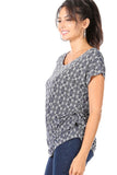 WOMAN WEARING SHORT SLEEVE BLUE PATTERNED TUNIC