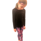 CHILD WEARING PINK AND NAVY LEGGINGS