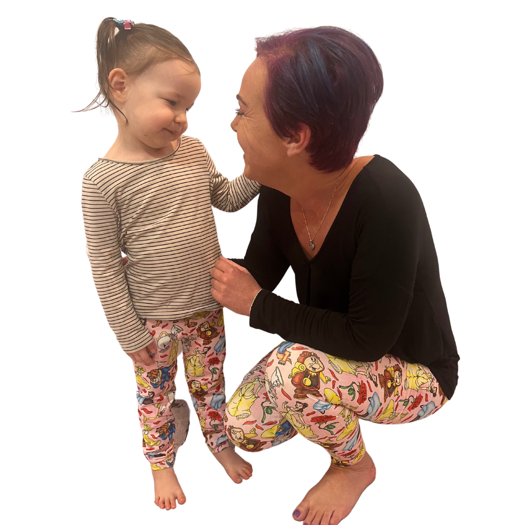 MOM AND DAUGHTER WEARING MATCHING BEAUTY AND THE BEAST LEGGINGS