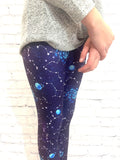 Toddler wearing blue galaxy leggings