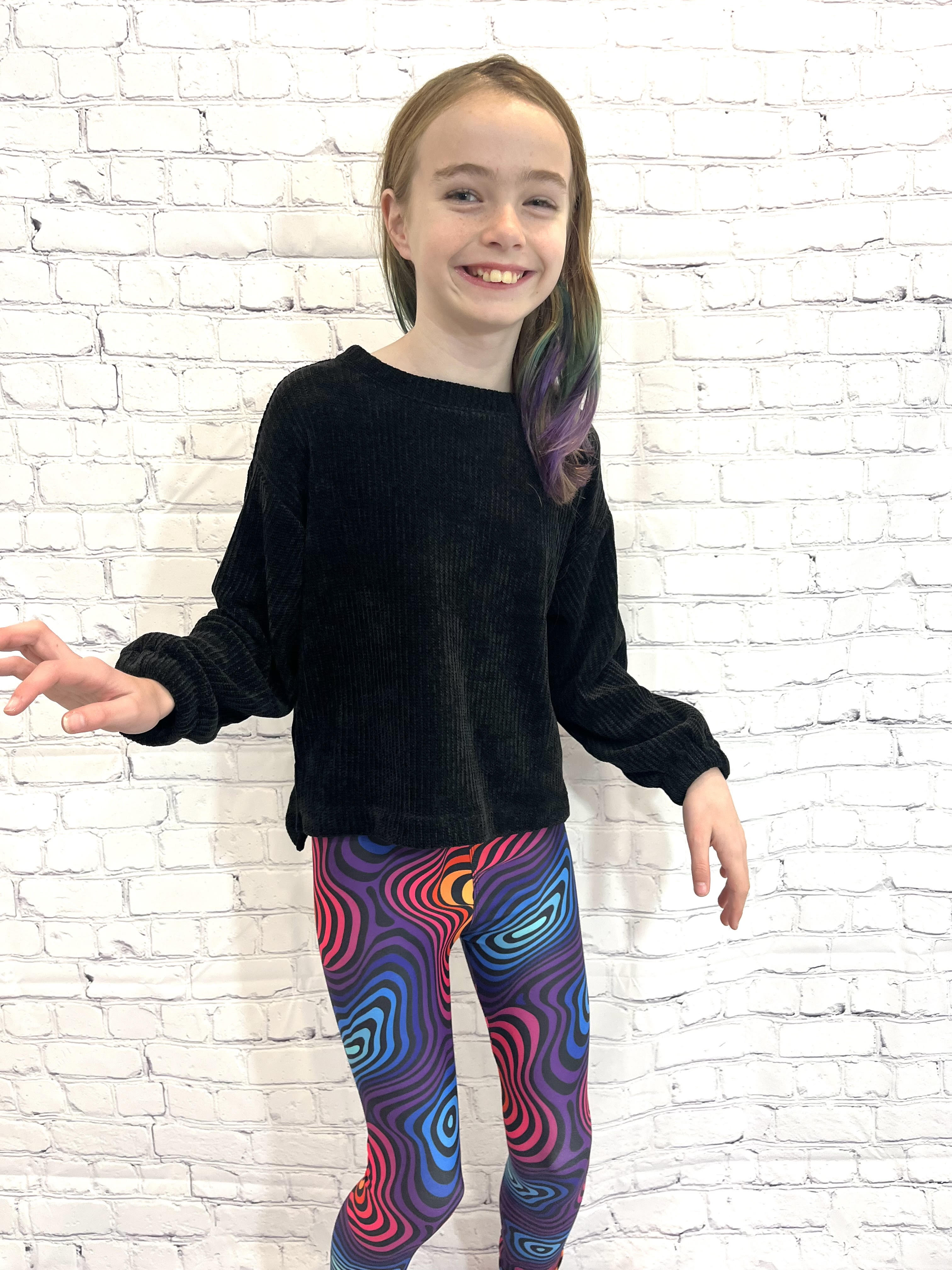 Girl wearing holographic leggings