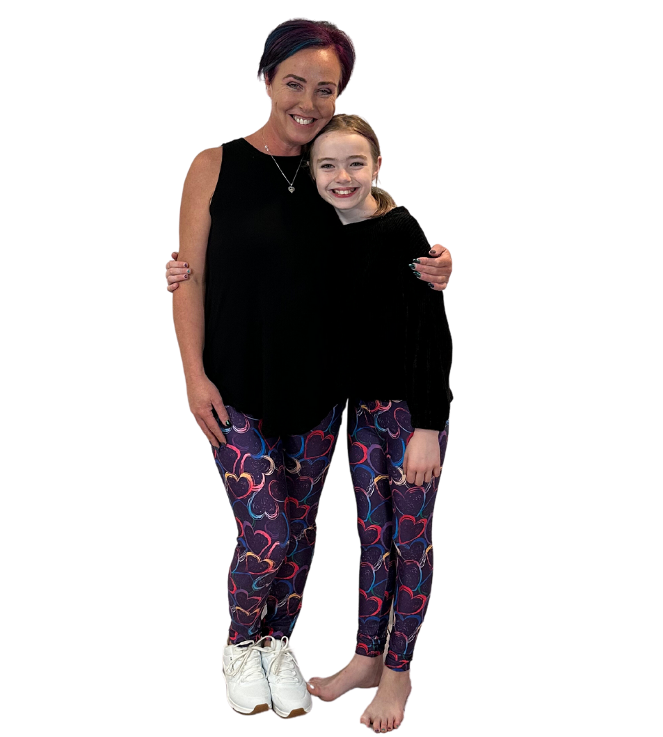 MOM AND DAUGHTER WEARING MATCHING HEART LEGGINGS