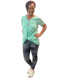 WOMAN WEARING MINT CUTOUT SHOULDER SHIRT