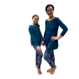 Mom and daughter wearing matching mermaid leggings
