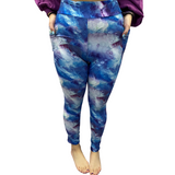 Woman wearing blue galaxy leggings with pockets