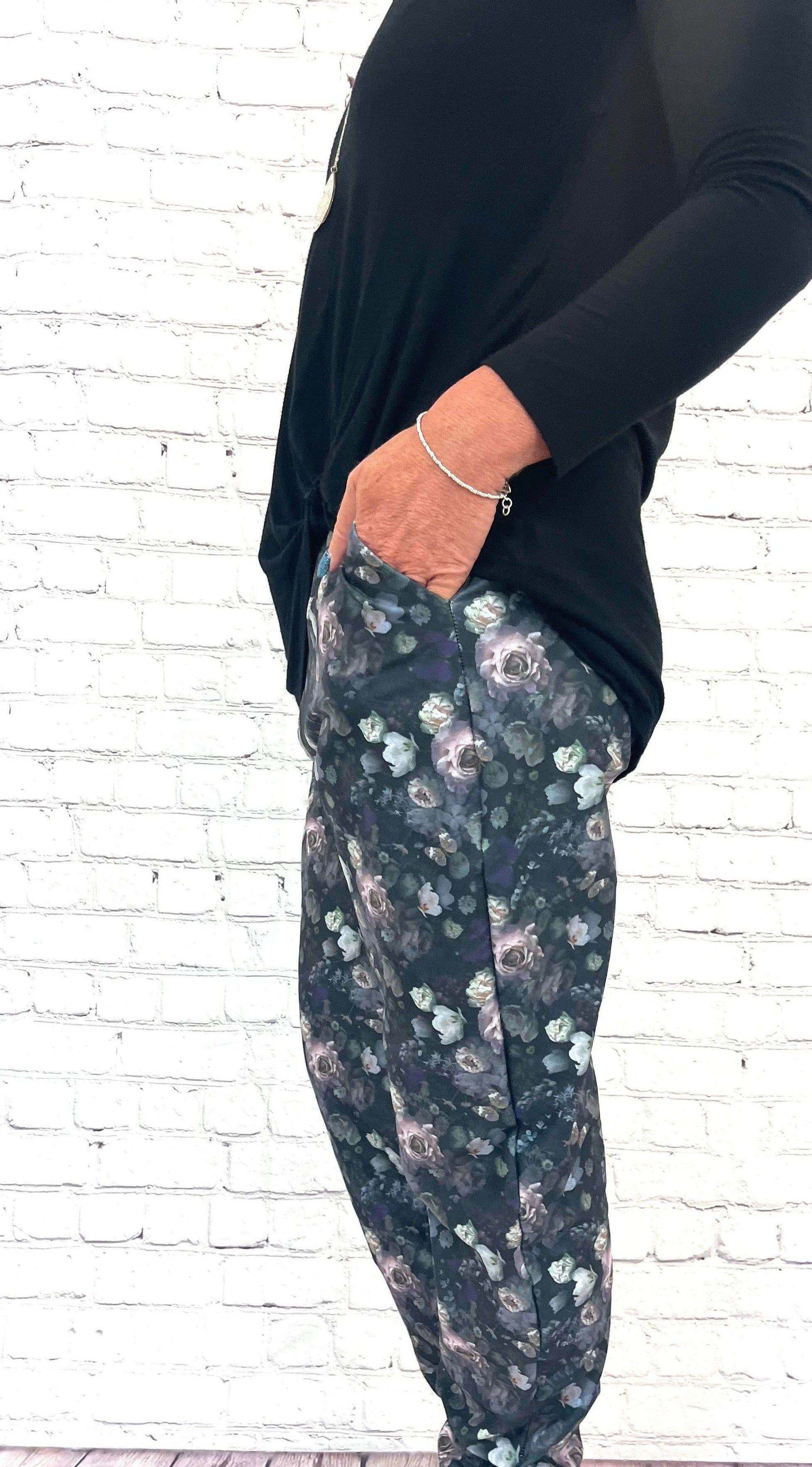 Woman wearing black floral jogging pants