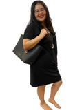 WOMAN WEARING PLUS SIZE BLACK DRESS WITH POCKETS