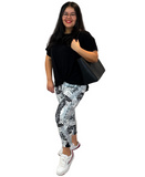 WOMAN WEARING PLUS BLACK AND WHITE CAPRIS