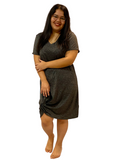 WOMAN WEARING A PLUS SIZE BLACK SUMMER DRESS WITH SIDE TWIST