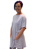 WOMAN WEARING PURPLE T-SHIRT DRESS WITH POCKETS