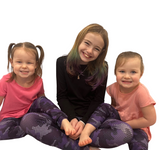 Girls wearing matching purple camo leggings