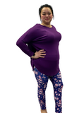 Woman wearing plus size navy patterned leggings