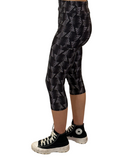 WOMAN WEARING BLACK AND GRAY CAPRIS