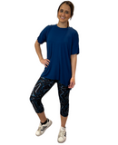 WOMAN WEARING BLACK AND TEAL CAPRIS