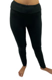 Woman wearing one size black leggings