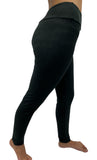 Woman wearing one size black leggings