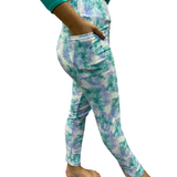 Woman wearing tie-dye yoga leggings with pockets
