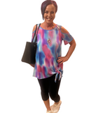 WOMAN WEARING TIE-DYE COLD SHOULDER TOP