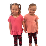 Toddler girls wearing pink butterfly leggings