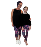 MOM AND DAUGHTER WEARING MATCHING LEGGINGS